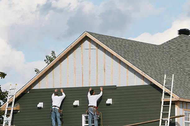 Professional Siding Replacement technician working in Woodward, PA